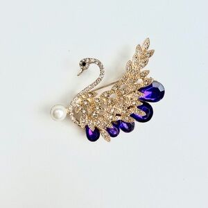 Elegant Swan Brooch with Purple and Gold Accents